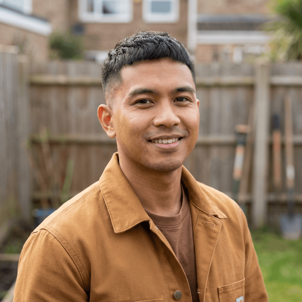 Marcus Chen, marriage counseling client, smiling softly at home
